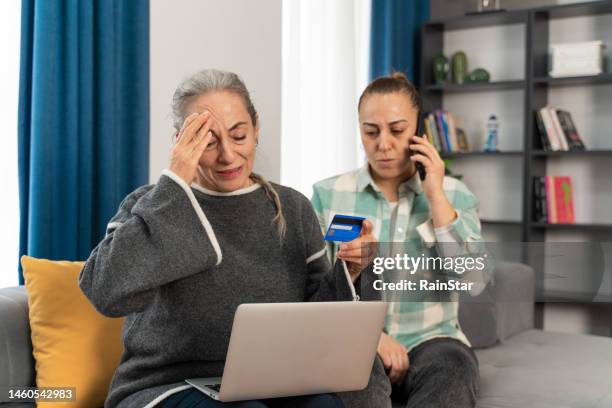 senior woman realizes she was scammed while shopping online - fraud stock pictures, royalty-free photos & images