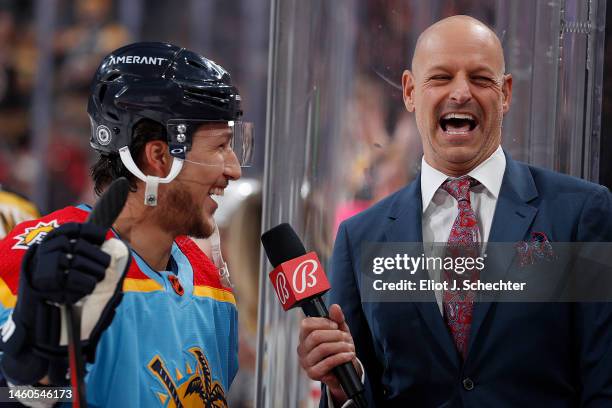 Steve Goldie Goldstein Bally Sports Florida Broadcaster chats with Brandon Montour of the Florida Panthers during warm ups prior to the start of the...