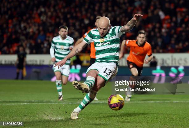 Aaron Mooy of Celtic scores his team's second goal from the penalty spot during the Cinch Scottish Premiership match between Dundee United and Celtic...