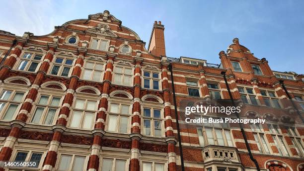 elegant red-brick victorian townhouses and residential buildings in knightsbridge, london - knightsbridge stock pictures, royalty-free photos & images