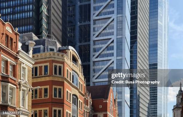 contrast between towers in the city of london and 19th century buildings in liverpool street. london, england - the past stock pictures, royalty-free photos & images