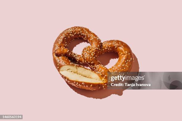 bread pretzels handmade on pink background. flat lay, top view, copy space - bun bread stock pictures, royalty-free photos & images