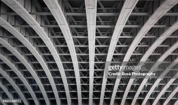 iron beams under bridge deck - construction frame fotografías e imágenes de stock