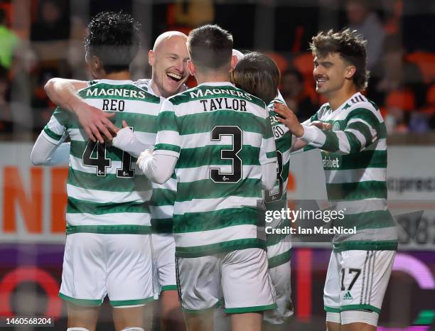 Aaron Mooy of Celtic is congratulated by team mates after scoring their second goal during the Cinch Scottish Premiership match between Dundee United...