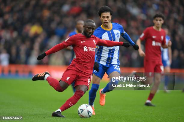 Naby Keita of Liverpool is challenged by Kaoru Mitoma of Brighton & Hove Albion during the Emirates FA Cup Fourth Round match between Brighton & Hove...
