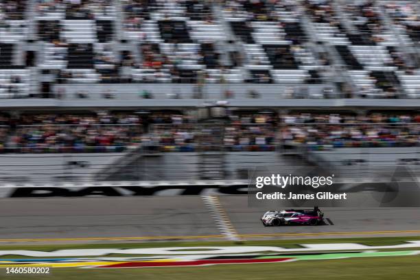 Tom Blomqvist, driver of the The Meyer Shank Racing w/ Curb-Agajanian Acura ARX-06 crosses the finish line to win the Rolex 24 at Daytona...