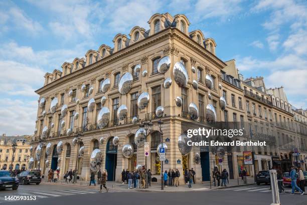 The facade of the Louis Vuitton Store displays a Yayoi Kusama robot and mirrors at Place Vendome on January 29, 2023 in Paris, France.