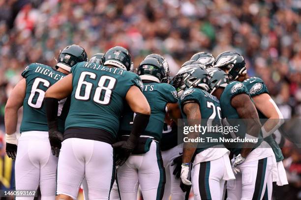 The Philadelphia Eagles huddle against the San Francisco 49ers during the first quarter in the NFC Championship Game at Lincoln Financial Field on...