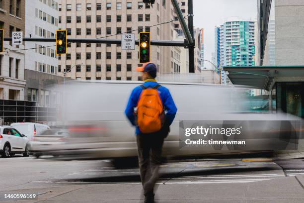 busy streets in downtown seattle - pedestrian winter stock pictures, royalty-free photos & images