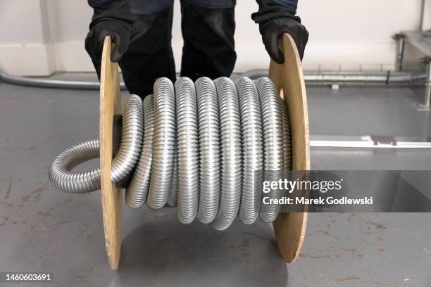 steel cable management baskets and trays with modular wiring, t conduit connector, drum of armored cable, electrical installation - home run stock pictures, royalty-free photos & images