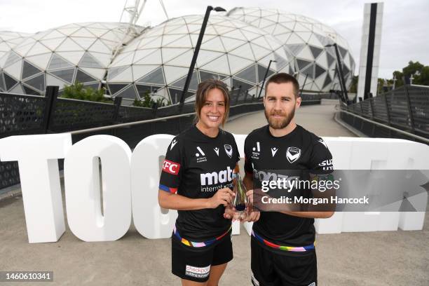 Kayla Morrison and Josh Brillante of the Melbourne Victory pose with the Pride Cup trophy during a media opportunity launching the A-Leagues pride...