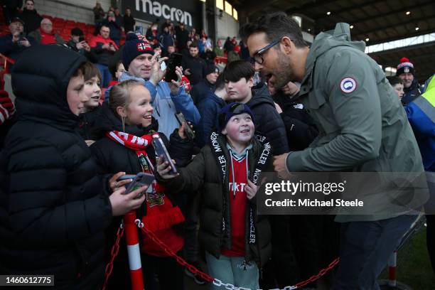 Ryan Reynolds, Co-Owner of Wrexham greets home supporters pitchside ahead of the Emirates FA Cup Fourth Round match between Wrexham and Sheffield...