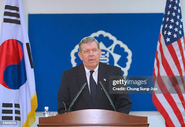 Assistant Secretary of State James Kelly speaks with reporters during a media conference at a government building October 5, 2002 in Seoul, South...