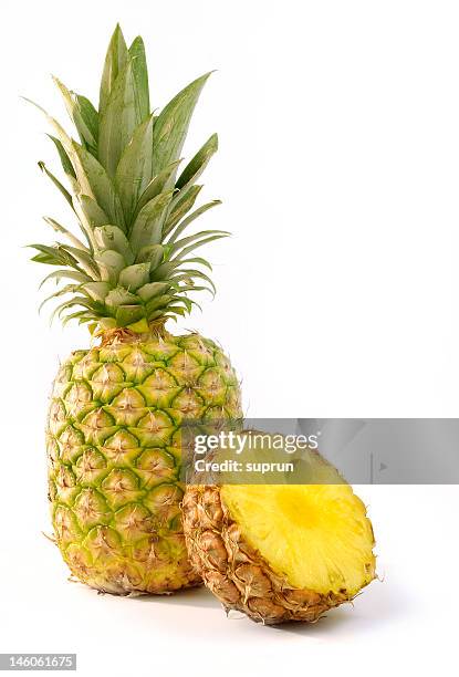 whole and halved pineapple isolated on white background - pineapple cut stock pictures, royalty-free photos & images