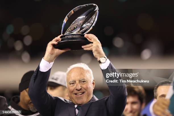 Owner Jeffrey Lurie of the Philadelphia Eagles hoist the George Halas Trophy after they defeated the San Francisco 49ers in the NFC Championship Game...