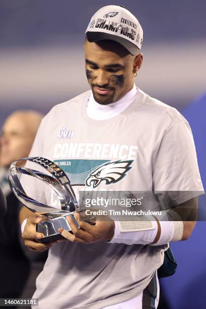 Jalen Hurts of the Philadelphia Eagles holds the George Halas Trophy after defeating the San Francisco 49ers to win the NFC Championship Game at...