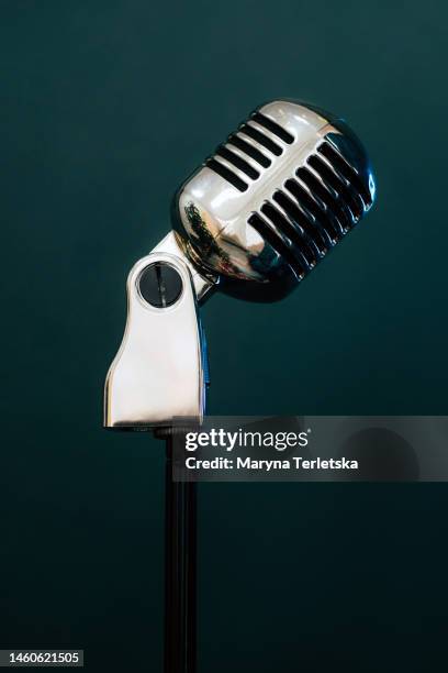 professional microphone on a black background. karaoke. recording a podcast. voice acting. blogger. asmr. - singing microphone stock pictures, royalty-free photos & images