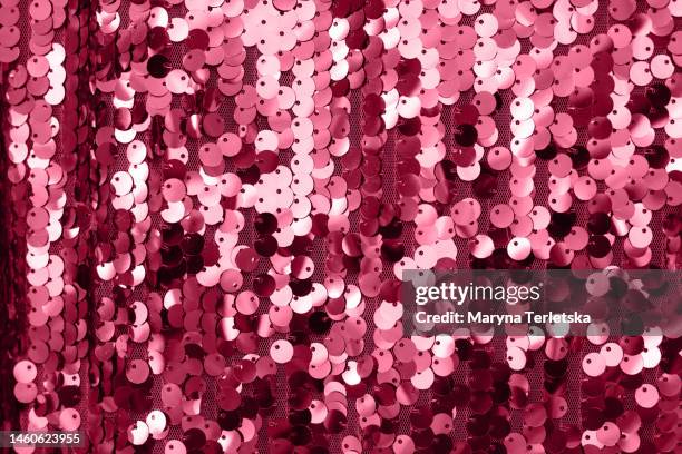 a beautiful versatile background in a stylish burgundy color. color of 2023. viva. magenta.background with sequins. fabric background. - maroon confetti stock pictures, royalty-free photos & images