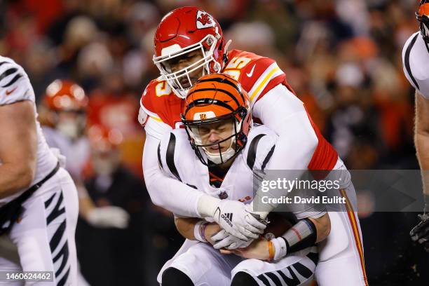 Chris Jones of the Kansas City Chiefs sacks Joe Burrow of the Cincinnati Bengals during the first quarter in the AFC Championship Game at GEHA Field...