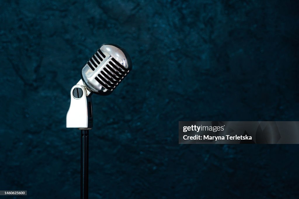 Professional microphone on a black background. Karaoke. Recording a podcast. Voice acting. Blogger. Asmr.
