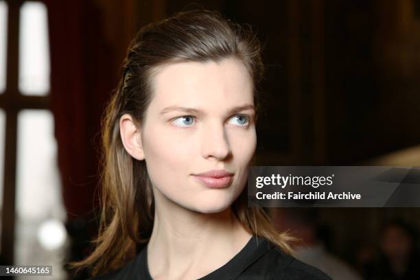 Model backstage at Balmain's fall 2013 runway show at Salons de l'Hotel de Ville.