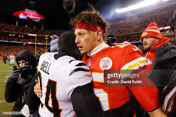 Vonn Bell of the Cincinnati Bengals and Patrick Mahomes of the Kansas City Chiefs embrace after their game in the AFC Championship Game at GEHA Field...