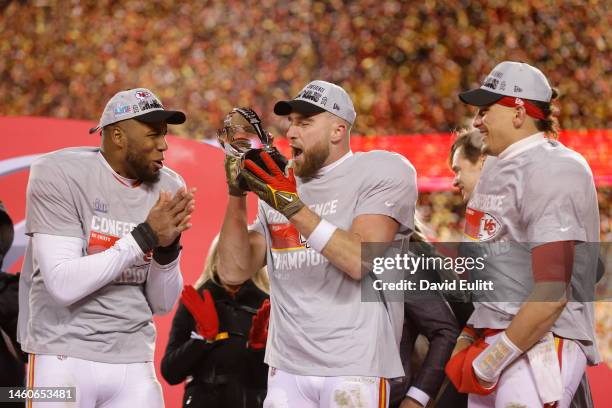 Travis Kelce of the Kansas City Chiefs celebrates with the Lamar Hunt Trophy after defeating the Cincinnati Bengals 23-20 in the AFC Championship...