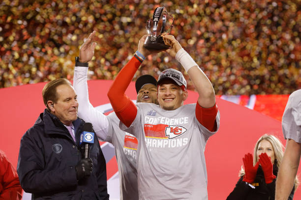 Patrick Mahomes of the Kansas City Chiefs celebrates with the Lamar Hunt Trophy after defeating the Cincinnati Bengals 23-20 in the AFC Championship...