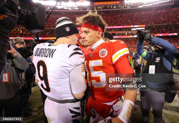 Joe Burrow of the Cincinnati Bengals and Patrick Mahomes of the Kansas City Chiefs meet on the field after the AFC Championship Game at GEHA Field at...