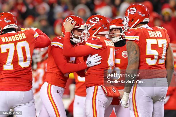 Harrison Butker of the Kansas City Chiefs celebrates with teammates after kicking the game winning field goal to defeat the Cincinnati Bengals 23-20...