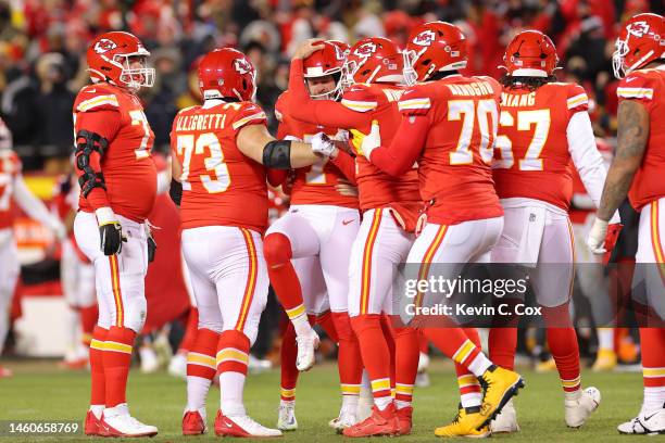 Harrison Butker of the Kansas City Chiefs celebrates with teammates after kicking the game winning field goal to defeat the Cincinnati Bengals 23-20...