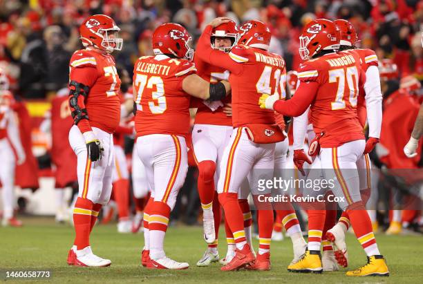 Harrison Butker of the Kansas City Chiefs celebrates with teammates after kicking the game winning field goal to defeat the Cincinnati Bengals 23-20...