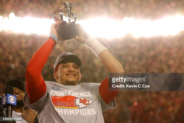 Patrick Mahomes of the Kansas City Chiefs holds up the Lamar Hunt Trophy after defeating the Cincinnati Bengals 23-20 in the AFC Championship Game at...