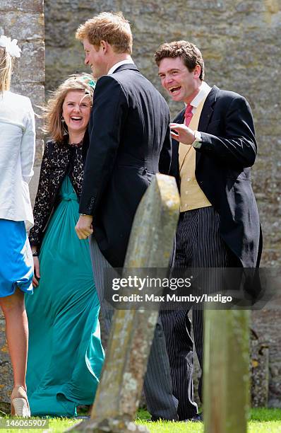 Prince Harry and James Meade attend the wedding of Emily McCorquodale and James Hutt at The Church of St Andrew and St Mary, Stoke Rochford on June...