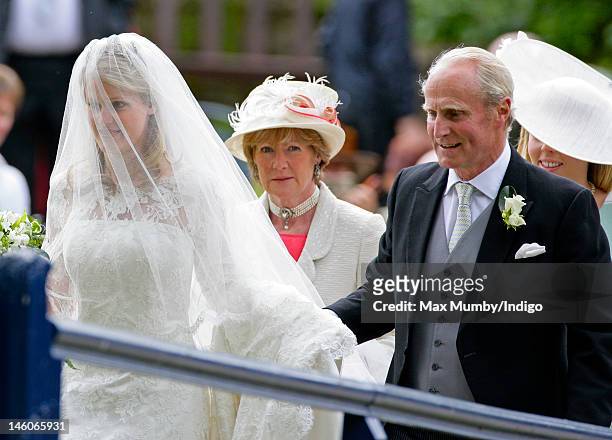 Emily McCorquodale, Lady Sarah McCorquodale and Neil McCorquodale arrive for Emily's wedding at The Church of St Andrew and St Mary, Stoke Rochford...