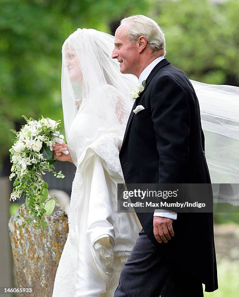 Emily McCorquodale and Neil McCorquodale arrive for Emily's wedding at The Church of St Andrew and St Mary, Stoke Rochford on June 9, 2012 in...