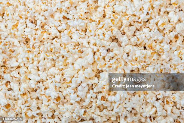 close up of freshly made pop corn - gold popcorn stock pictures, royalty-free photos & images
