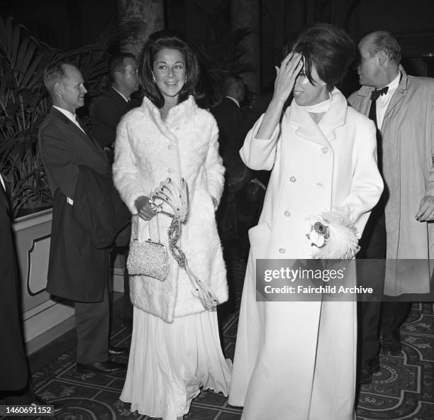 Two women arriving at Truman Capote's Black and White Ball in the Grand Ballroom at the Plaza Hotel in New York City