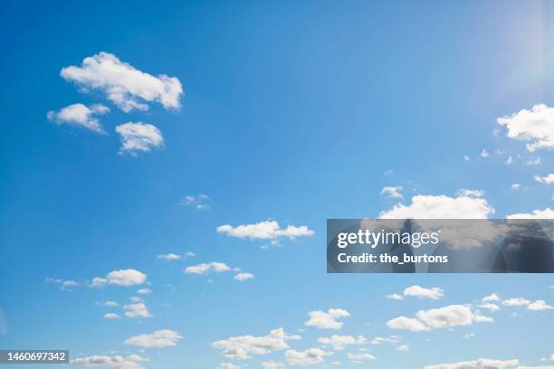 full frame shot of blue sky and clouds, abstract background - cielo nubes fotografías e imágenes de stock