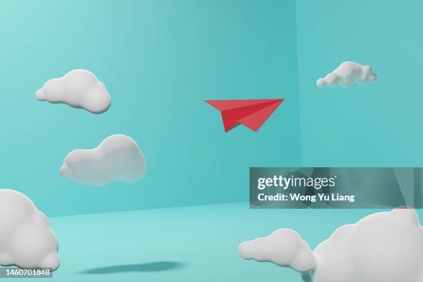 red paper plane in clouds ,3d render concept photo - paper plane stock-fotos und bilder