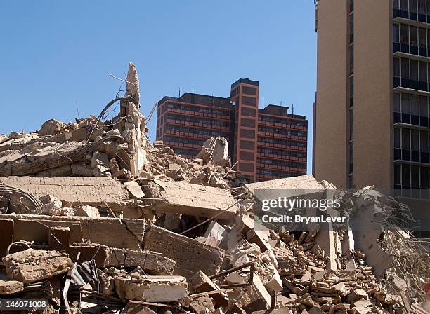 piles of concrete rubble after implosion - rubble explosion stock pictures, royalty-free photos & images