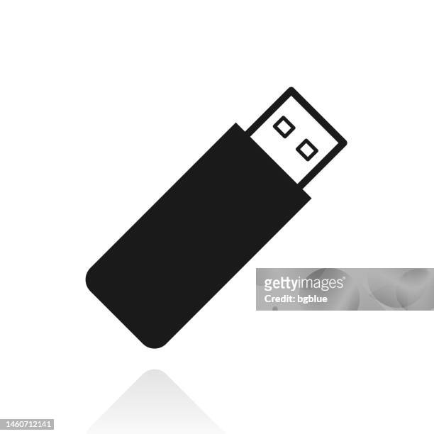 usb flash drive. icon with reflection on white background - usb stick stock illustrations