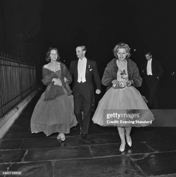 British socialite Andrew Parker-Bowles and two women named as Gillian Fenwick and Jane Rotner attend a party in London on November 10th, 1959.