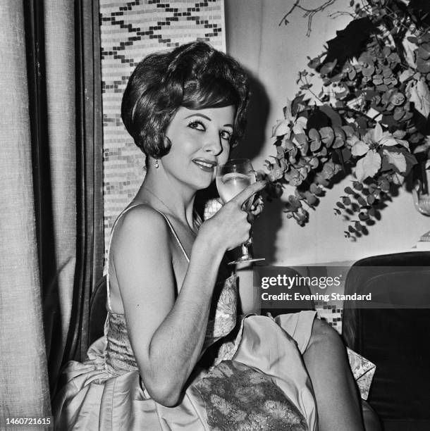 American actress and burlesque dancer Tempest Storm posing at the Savoy Hotel in London on December 27th, 1960. Storm is to appear at the Raymond...