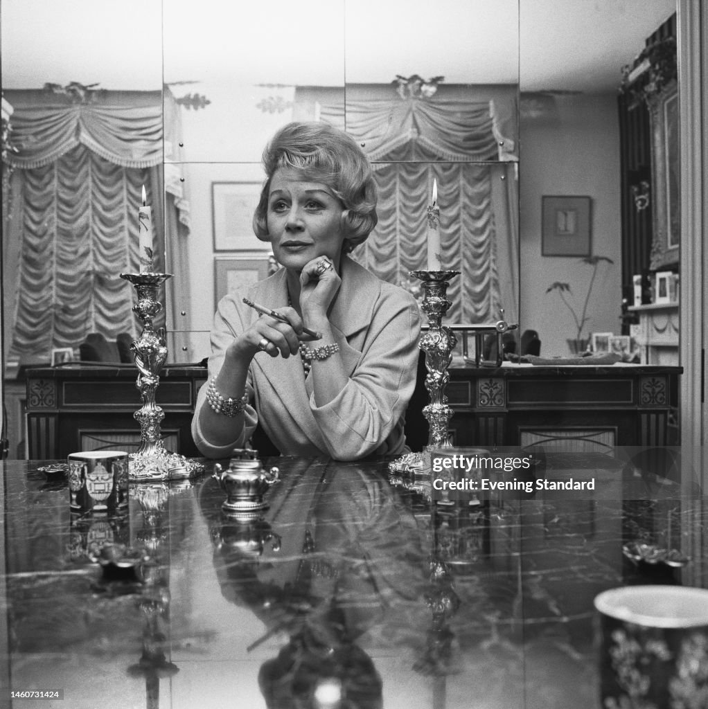 British actress Margaret Leighton smoking at a table on January 12th ...