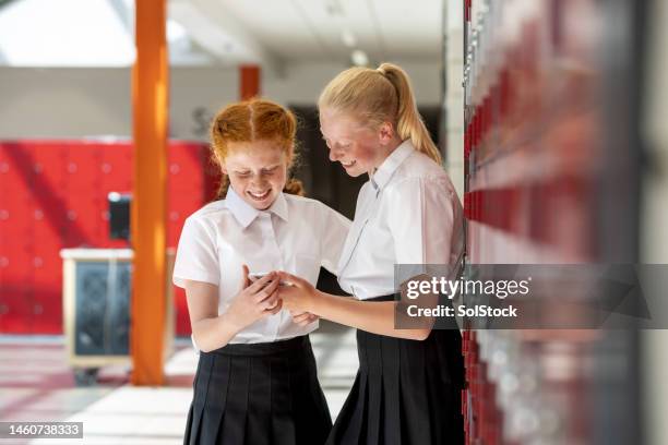 best friends in school - uniform stock pictures, royalty-free photos & images