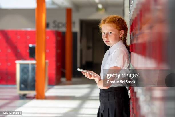 disappointed at school - child on phone stock pictures, royalty-free photos & images
