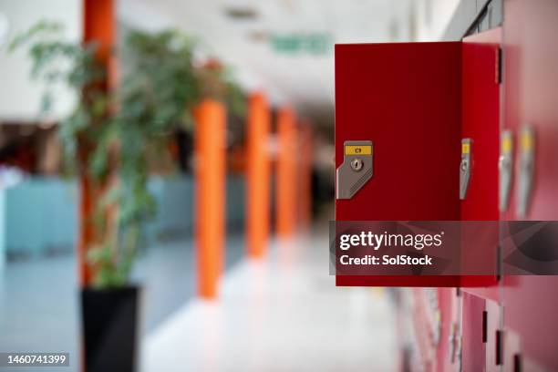 open locker in an empty school - high school locker room stock pictures, royalty-free photos & images