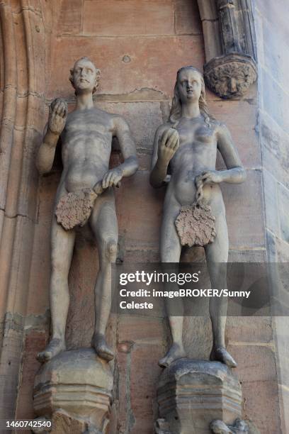 figures, adam and eve at the main entrance of the church sankt moritz, coburg, upper franconia, bavaria, germany - adam biblical figure stock pictures, royalty-free photos & images