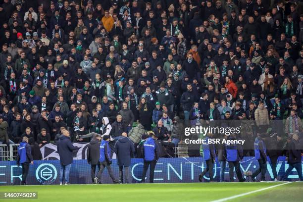 Groningen hooligans storm the pitch during the Dutch Eredivisie match between FC Groningen and SC Cambuur at Euroborg on January 26, 2023 in...